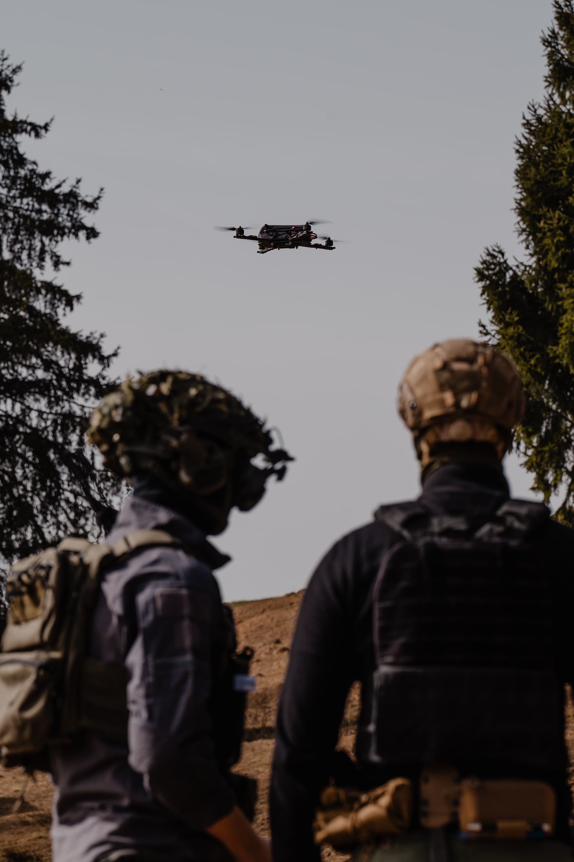 Operators watching drone fly